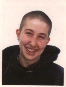 A photo of me from the 1990s with a shaved head.