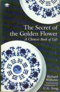 Image of the book cover for 'The Secret of the Golden Flower'. It is navy blue with two blue and white mandalas.